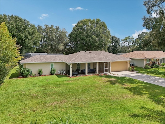 ranch-style home featuring a garage and a front lawn