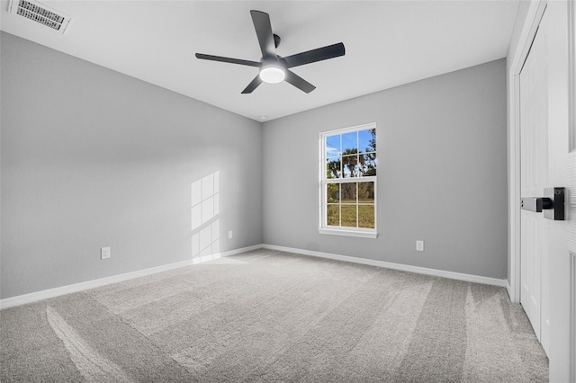 carpeted empty room with ceiling fan