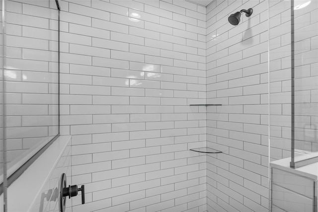 bathroom with tiled shower