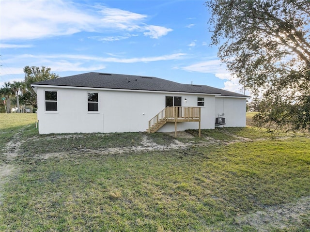 back of property featuring a yard