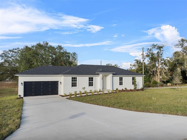 ranch-style home featuring a garage and a front yard