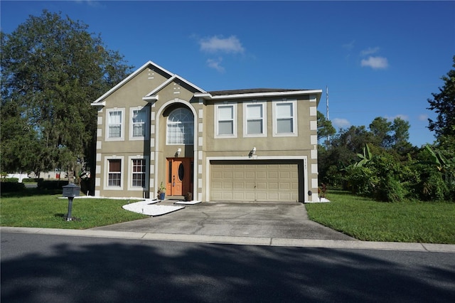 view of front of home featuring a garage and a front lawn