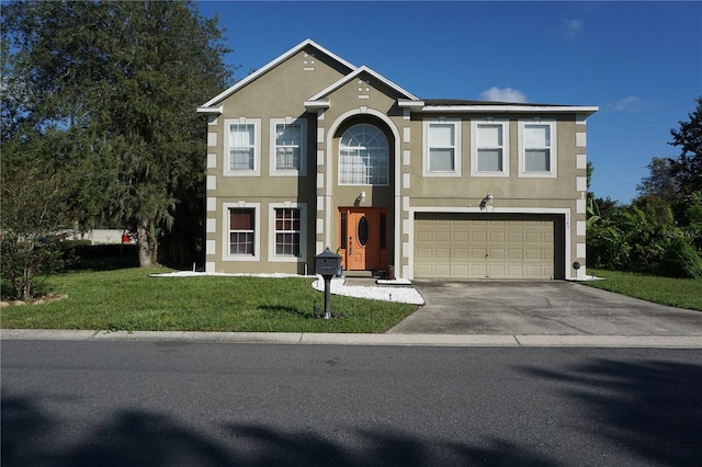 view of front of house with a front yard and a garage