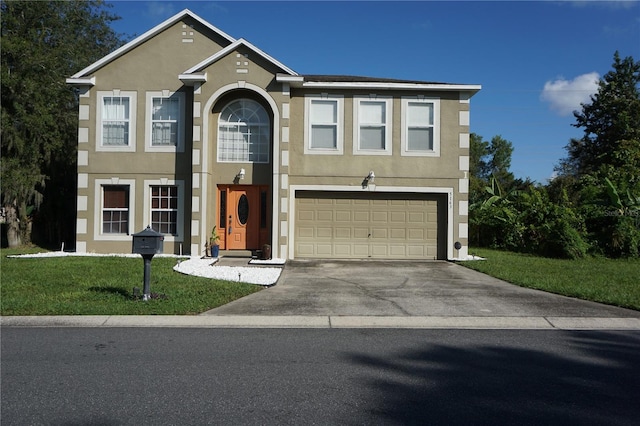 view of front of home with a front lawn and a garage