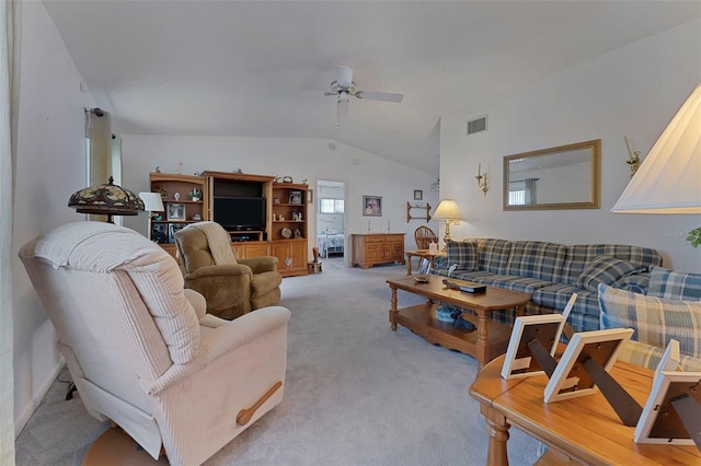 living room with ceiling fan, light colored carpet, and lofted ceiling