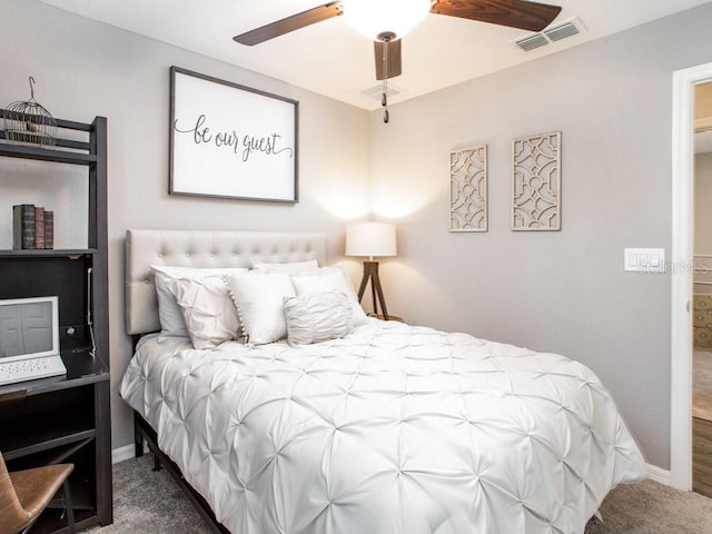 bedroom with ceiling fan and carpet floors