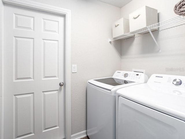 washroom with independent washer and dryer