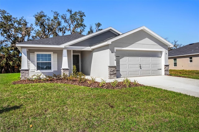 craftsman-style home with a garage and a front lawn