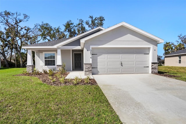 view of front of house with a garage and a front lawn