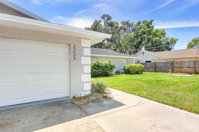 garage featuring a lawn