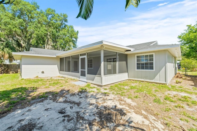 rear view of house with a sunroom