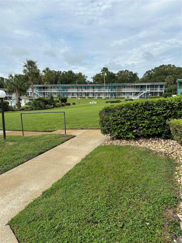 view of property's community featuring a yard