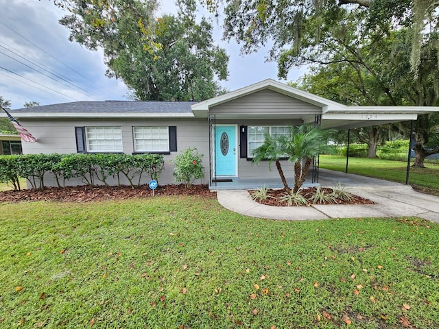 ranch-style house with a carport and a front yard