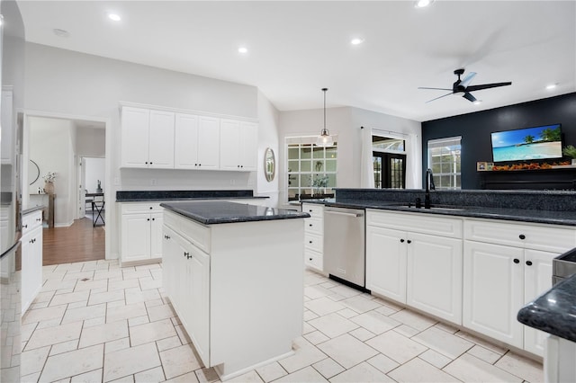 kitchen featuring sink, white cabinetry, decorative light fixtures, a center island, and dishwasher