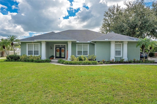 view of front of house featuring a front yard and french doors