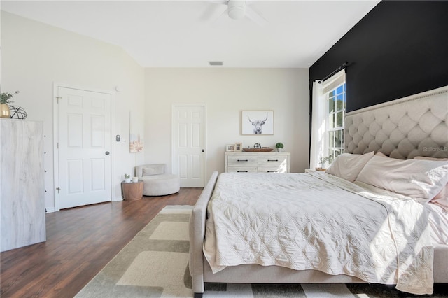 bedroom with dark wood-type flooring