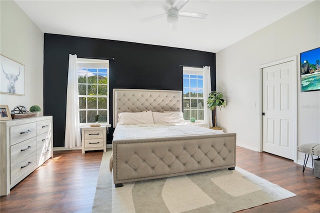 bedroom with dark wood-type flooring and ceiling fan