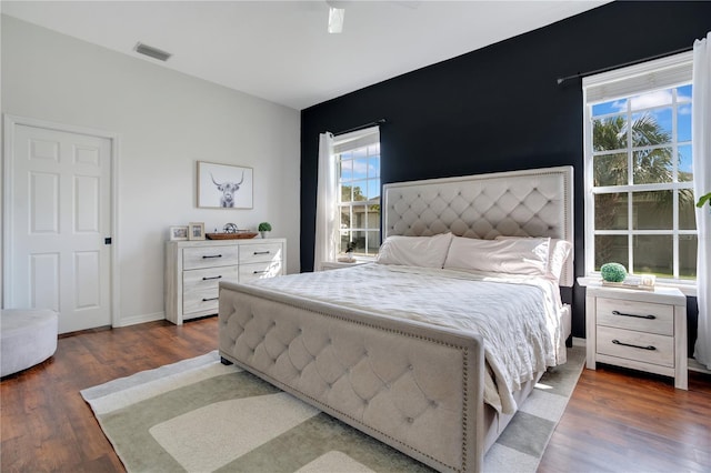 bedroom featuring dark hardwood / wood-style flooring