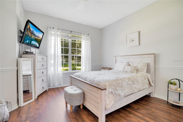 bedroom with dark wood-type flooring