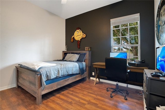 bedroom featuring hardwood / wood-style floors and ceiling fan