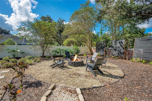 view of yard featuring an outdoor fire pit