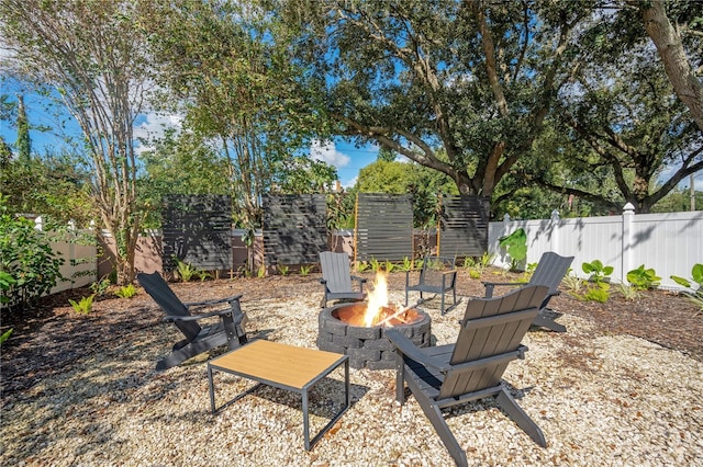 view of yard featuring an outdoor fire pit