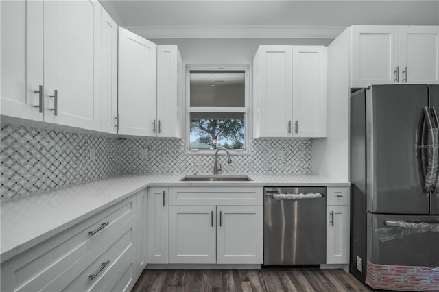 kitchen featuring white cabinetry, stainless steel appliances, and sink