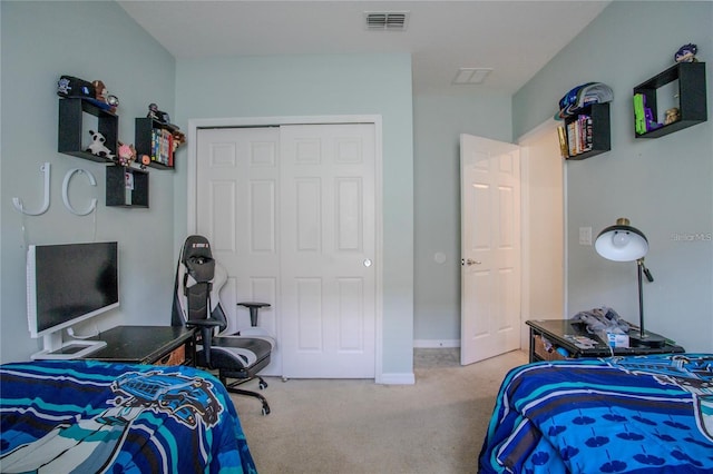 bedroom featuring a closet and carpet floors