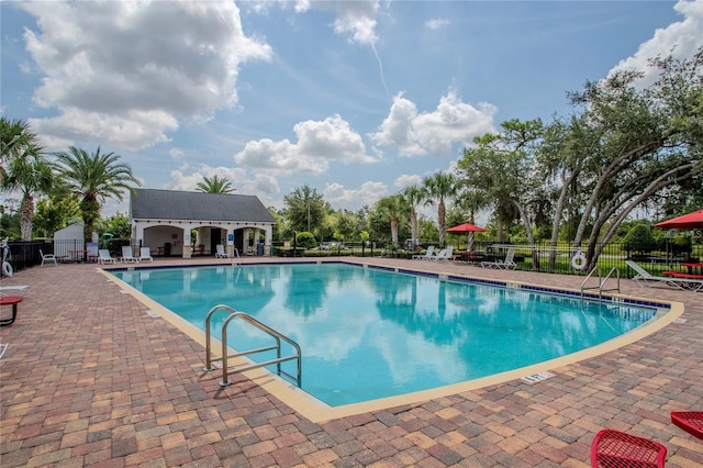 view of swimming pool featuring a patio area