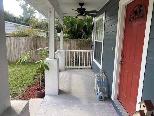 view of patio with ceiling fan and a porch