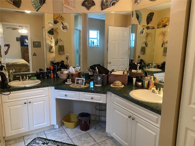 bathroom featuring tile patterned floors, vanity, ceiling fan, and an enclosed shower