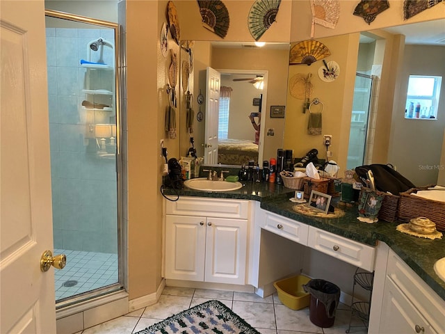 bathroom featuring vanity, tile patterned floors, walk in shower, and ceiling fan