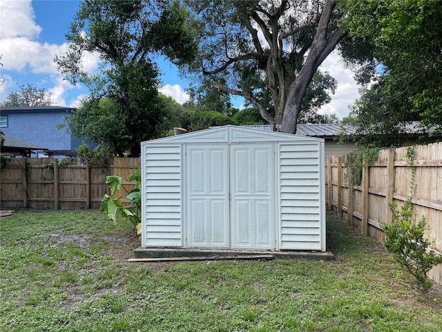 view of outbuilding with a lawn