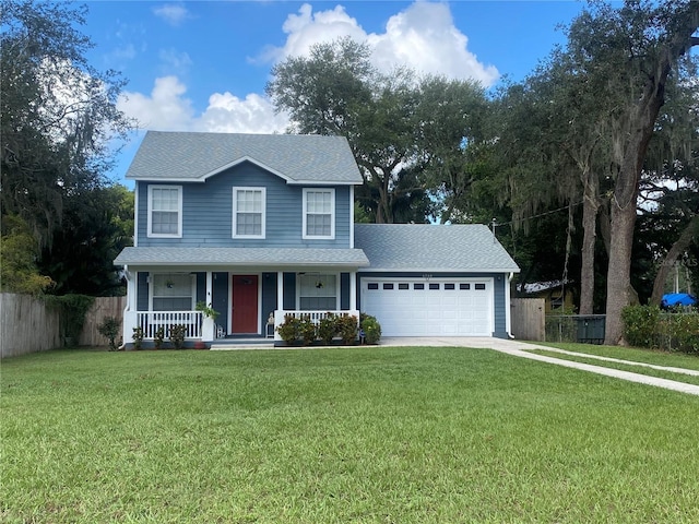 view of front property with a front yard, a porch, and a garage