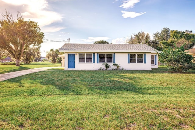 single story home featuring a front yard