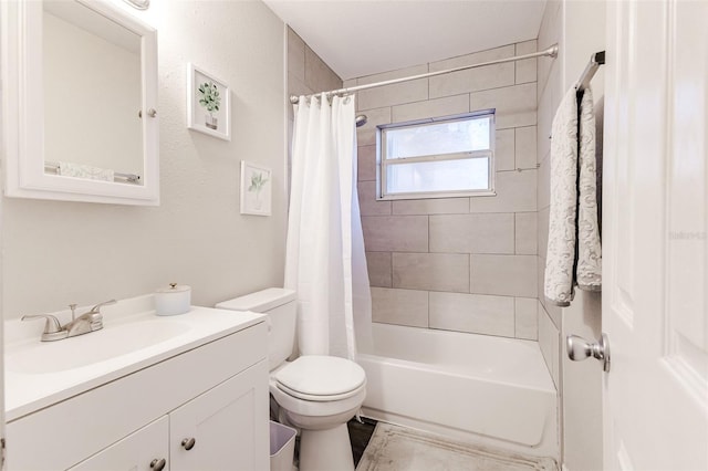 full bathroom with shower / bath combo, vanity, and toilet