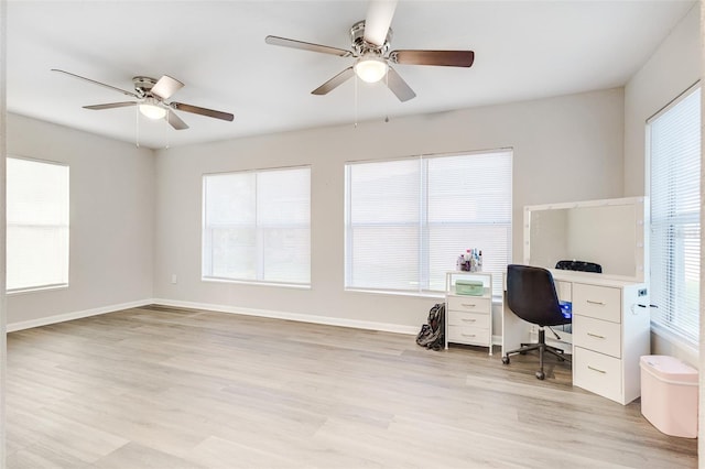 office space with ceiling fan and light hardwood / wood-style flooring