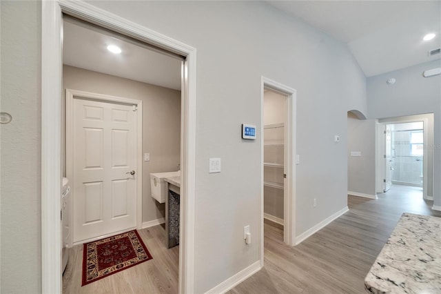 laundry area featuring light hardwood / wood-style floors