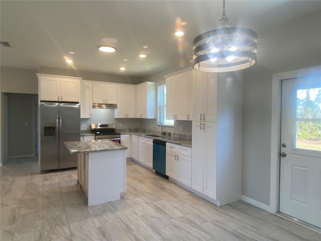 kitchen with white cabinetry, sink, a center island, hanging light fixtures, and appliances with stainless steel finishes