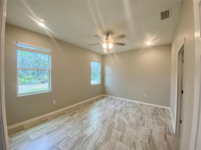 spare room featuring ceiling fan