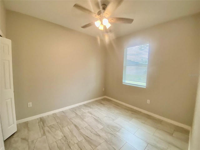 unfurnished room with ceiling fan