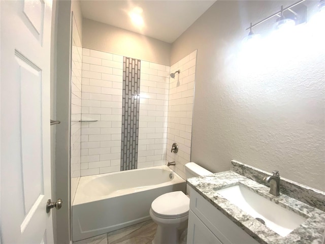 full bathroom with tiled shower / bath combo, toilet, and vanity