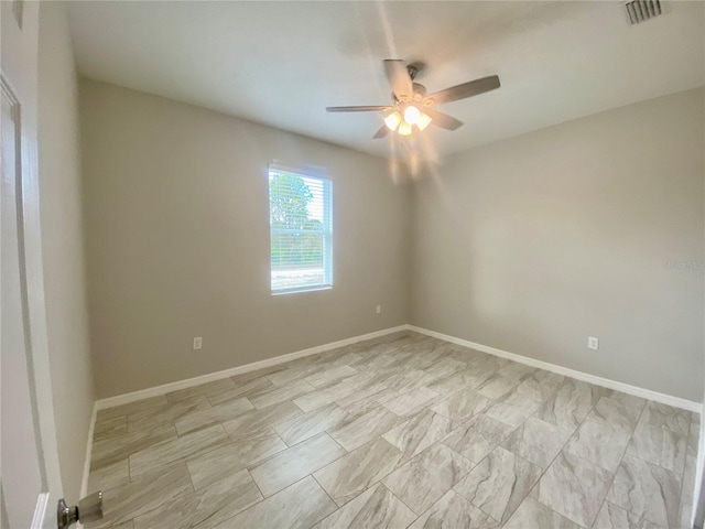 unfurnished room with ceiling fan