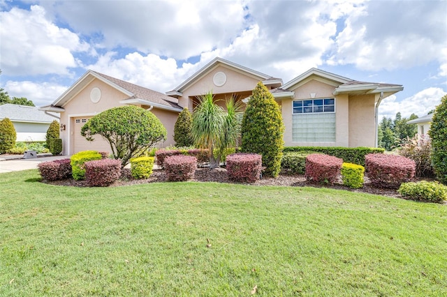 view of front of property featuring a garage and a front yard