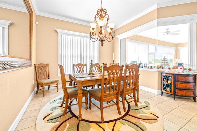 dining space with ceiling fan with notable chandelier, crown molding, and light tile patterned floors