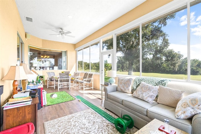 sunroom with ceiling fan