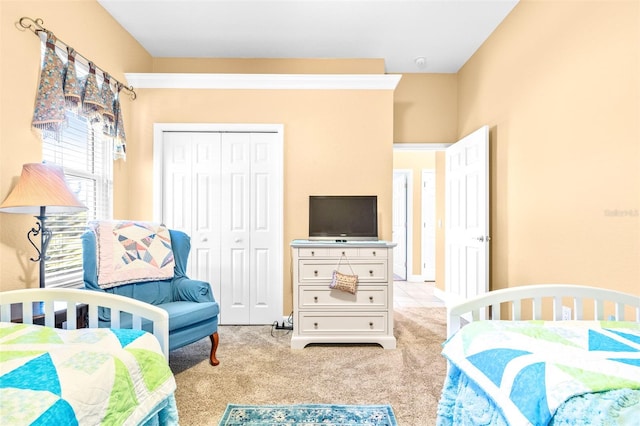 carpeted bedroom featuring a closet