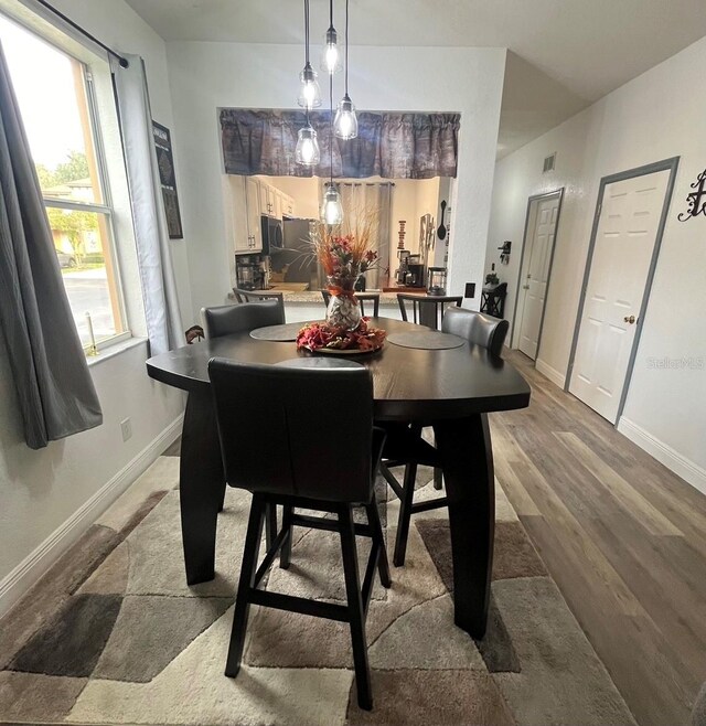 dining room featuring wood-type flooring