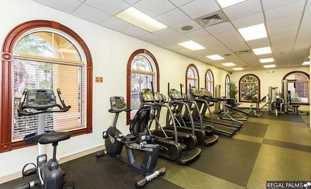 exercise room featuring a drop ceiling