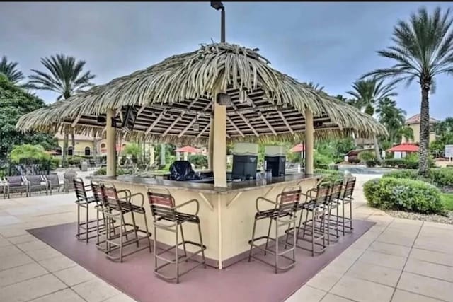 view of patio / terrace featuring an outdoor bar